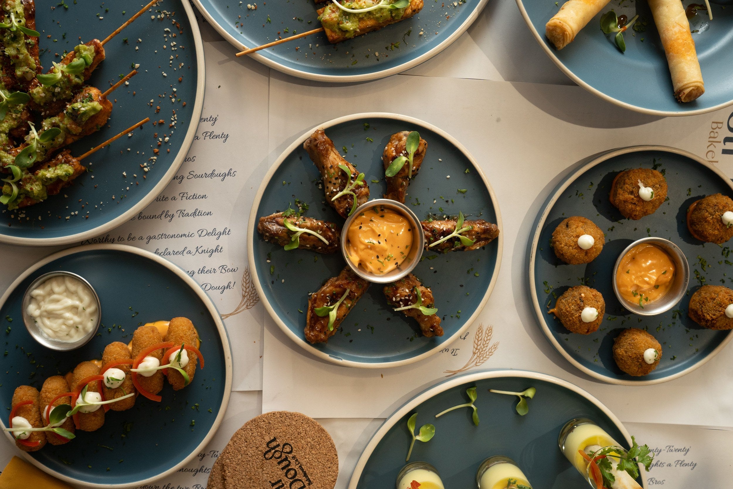 A selection of food dishes on blue plates